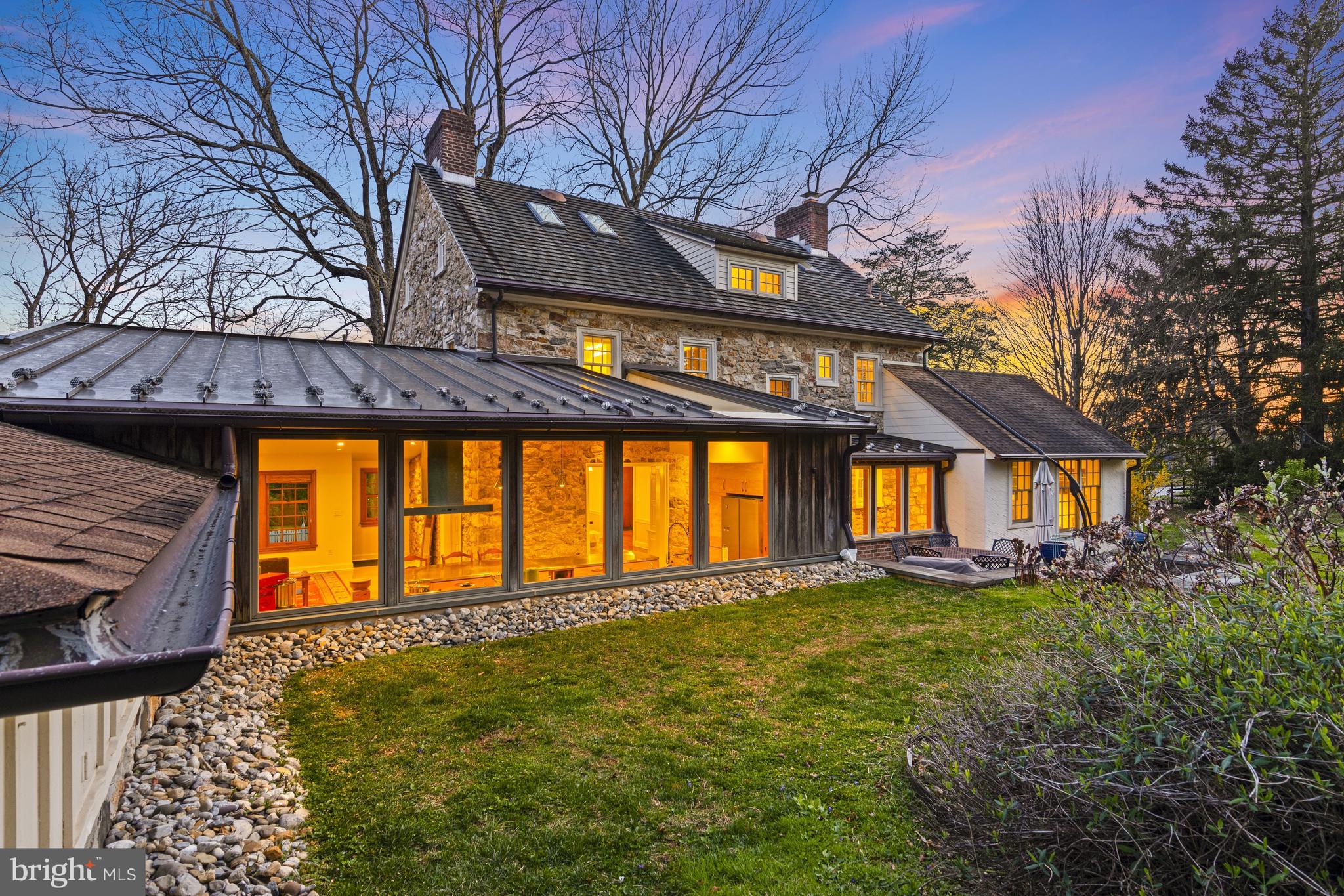 1439 Old Wilmington Road Hockessin, DE 19707 - Photo 44 of 57 a large building with a big yard and large trees