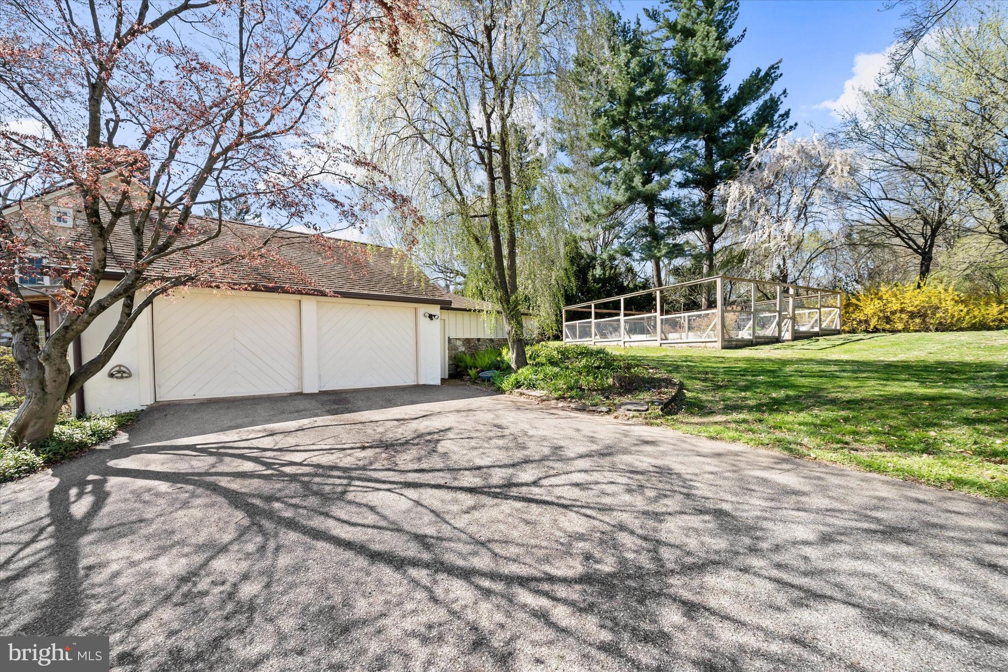 1439 Old Wilmington Road Hockessin, DE 19707 - Photo 52 of 57 a view of a house with a yard and garage