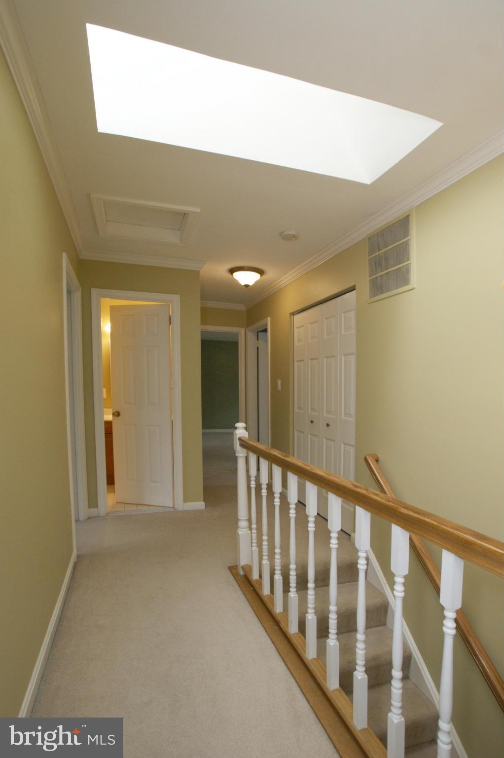 7804 Cliffside Court Springfield, VA 22153 - Photo 14 of 30 Upstairs hall with sky light.