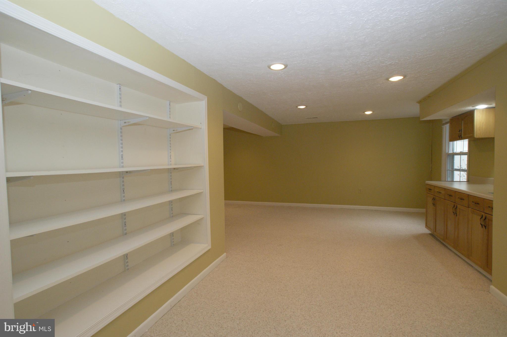 7804 Cliffside Court Springfield, VA 22153 - Photo 26 of 30 Basement, built in shelves, wet bar