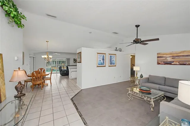 a kitchen with stainless steel appliances granite countertop a refrigerator sink and stove