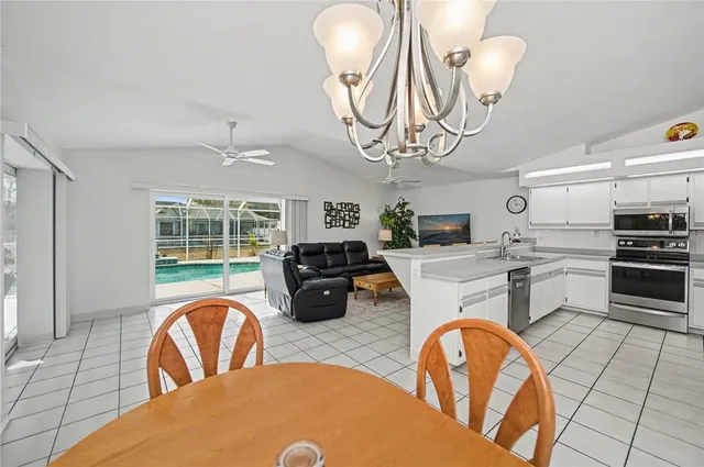 a bedroom with a bed and a ceiling fan