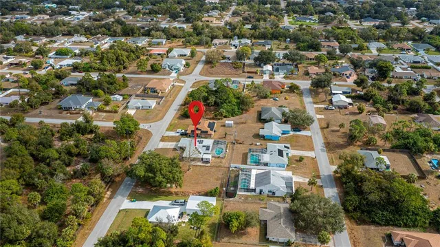 an aerial view of residential houses with outdoor space
