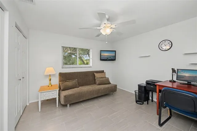 a view of a house with backyard sitting area and garden