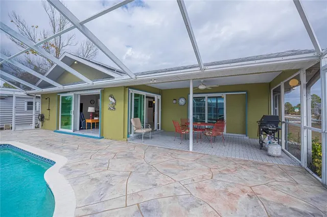 an aerial view of residential houses with outdoor space and lake view