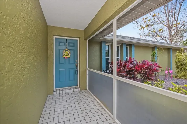 front view of a house with a potted plant