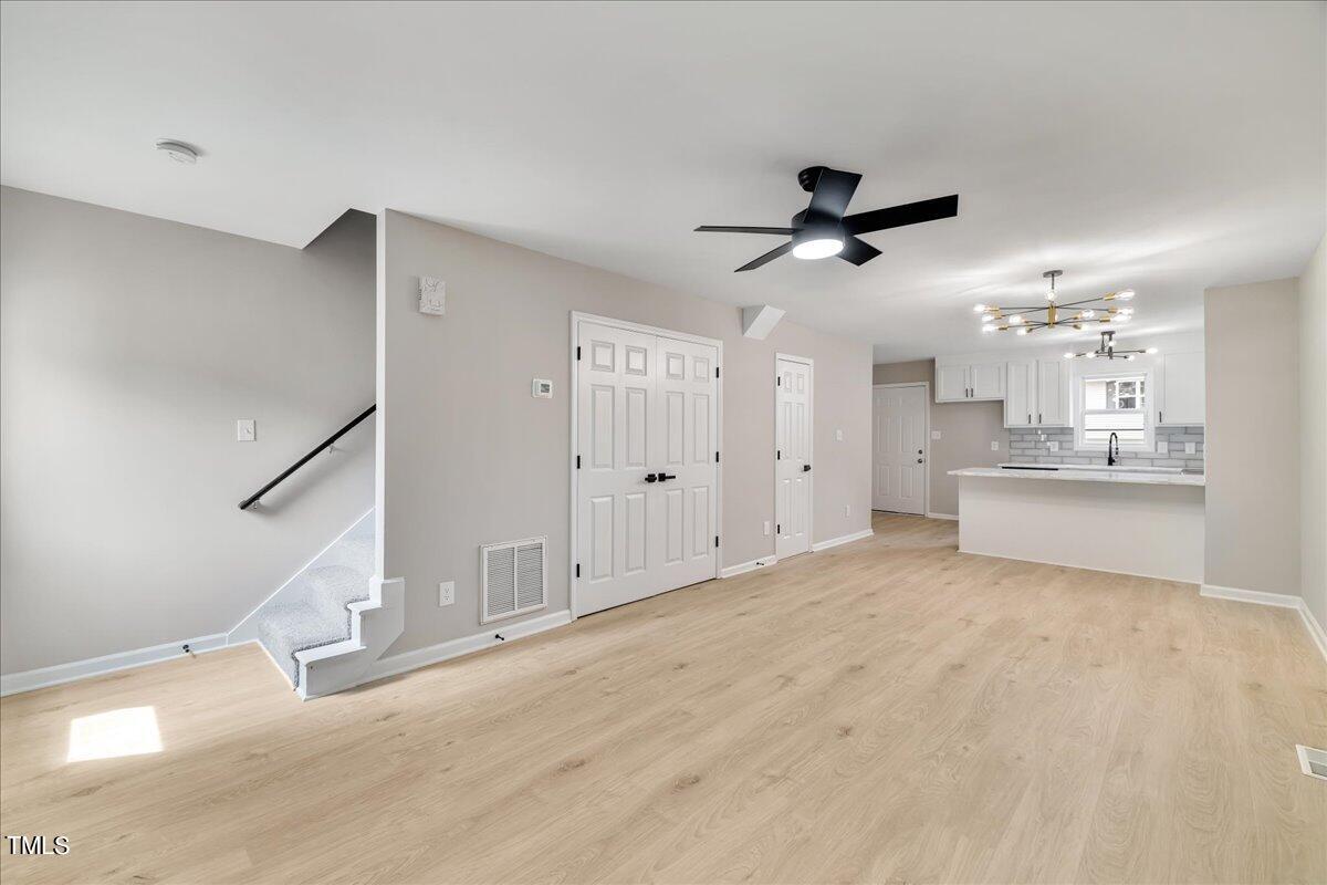 403 East Williams Street Angier, NC 27501 - Photo 11 of 38 a view of a kitchen with a sink and cabinet area