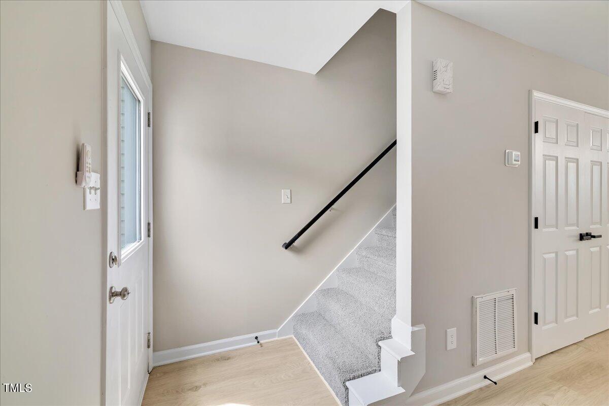 403 East Williams Street Angier, NC 27501 - Photo 16 of 38 a view of a hallway with staircase
