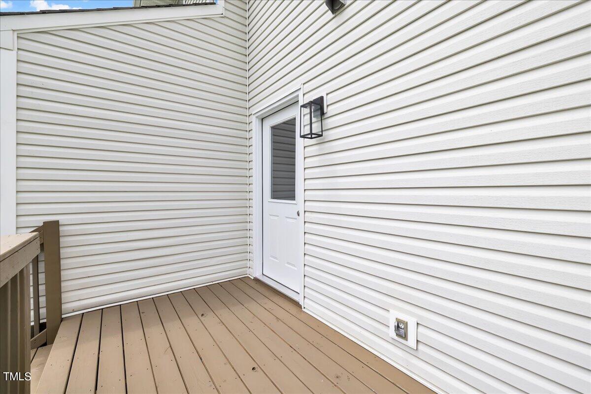 403 East Williams Street Angier, NC 27501 - Photo 28 of 38 a view of a balcony with wooden floor