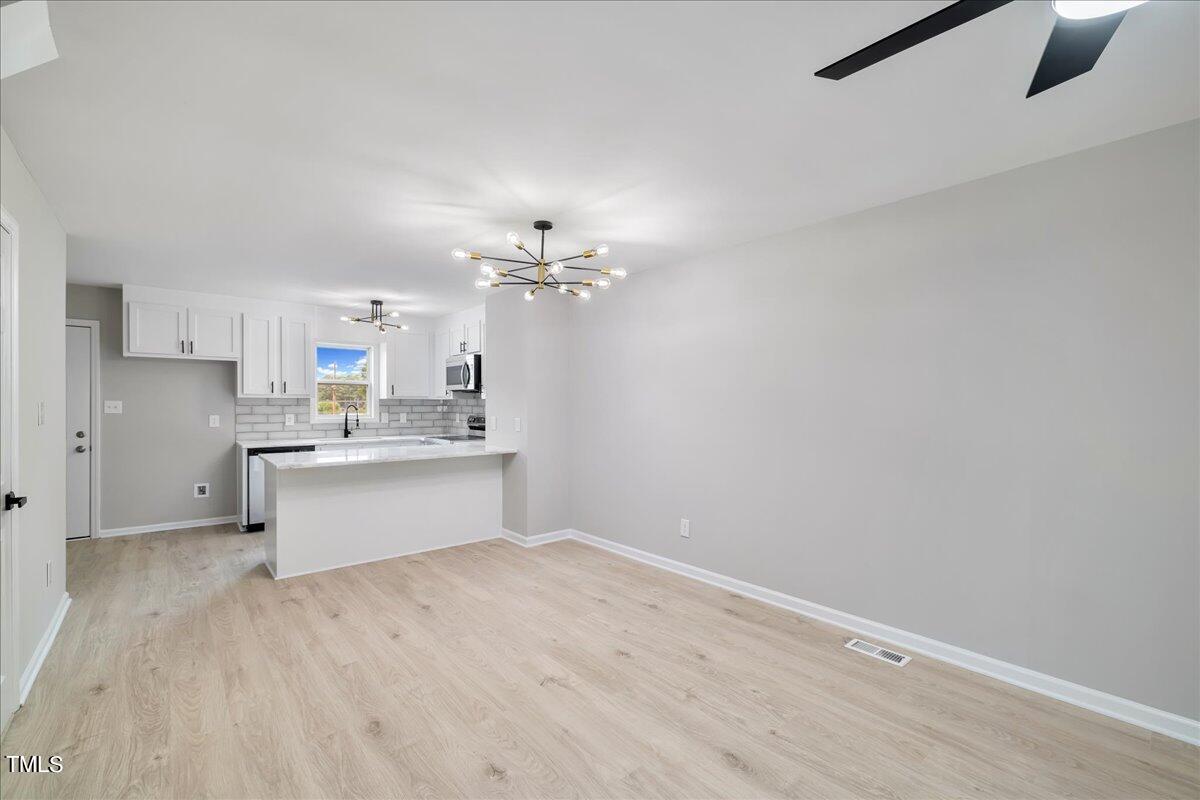 403 East Williams Street Angier, NC 27501 - Photo 8 of 38 a view of kitchen and center island