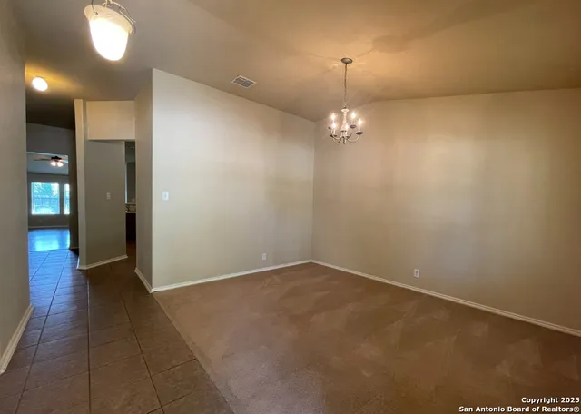 wooden floor in an empty room with a mirror