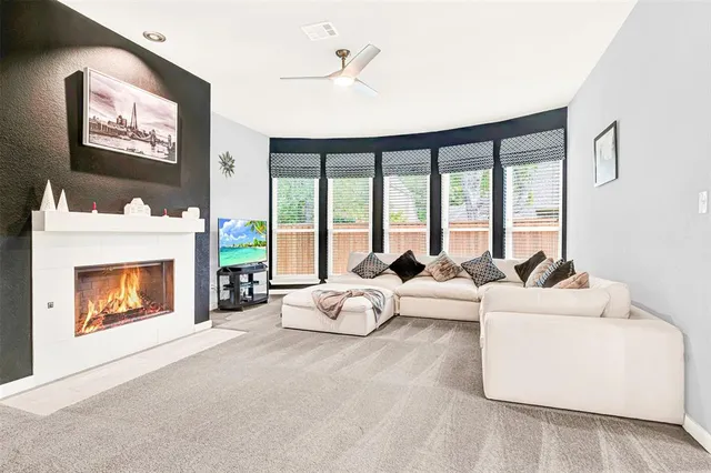 a view of a backyard with table and chairs and a fire pit
