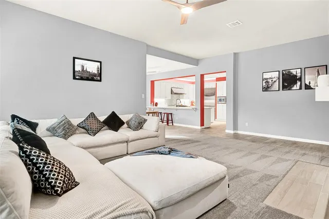 a backyard of a house with table and chairs