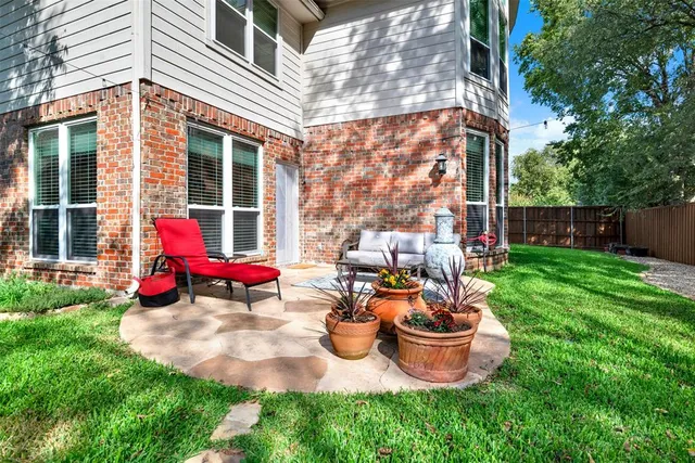 a bathroom with a sink a toilet and a window