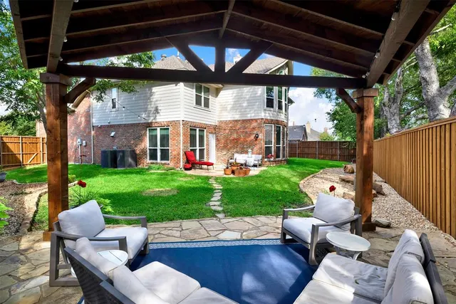 an aerial view of house with yard swimming pool and outdoor seating