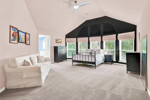 a front view of a house with a yard and a fountain