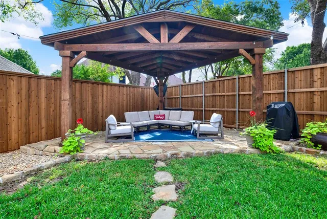 a view of a dining room with furniture and window