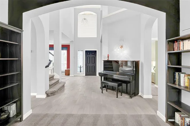 a bedroom with a bed and a lamp