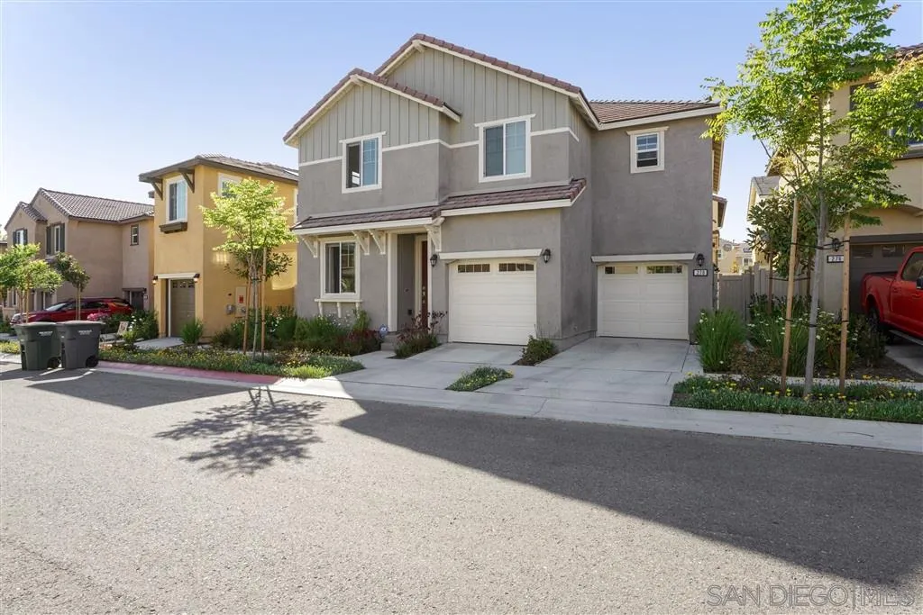 270 Oberlander Way Fallbrook, CA 92028 - Photo 1 of 23 a front view of a house with a yard and a garage