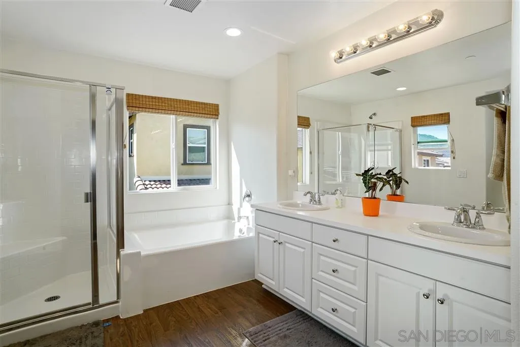 270 Oberlander Way Fallbrook, CA 92028 - Photo 14 of 23 a bathroom with double vanity sink a mirror and a shower
