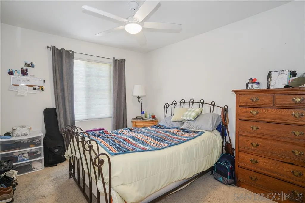 270 Oberlander Way Fallbrook, CA 92028 - Photo 15 of 23 a bedroom with a bed and a dresser