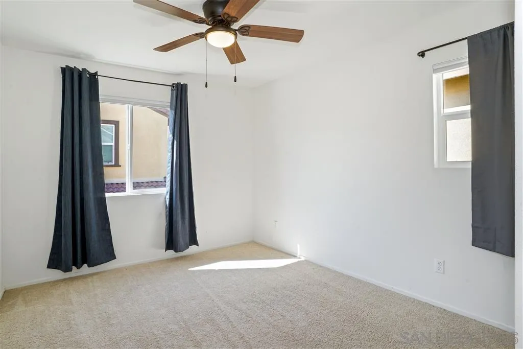 270 Oberlander Way Fallbrook, CA 92028 - Photo 16 of 23 an empty room with closet and a window