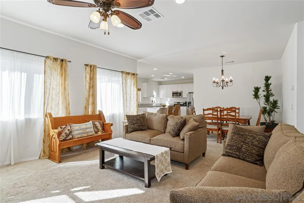 270 Oberlander Way Fallbrook, CA 92028 - Photo 5 of 23 a living room with furniture and a chandelier
