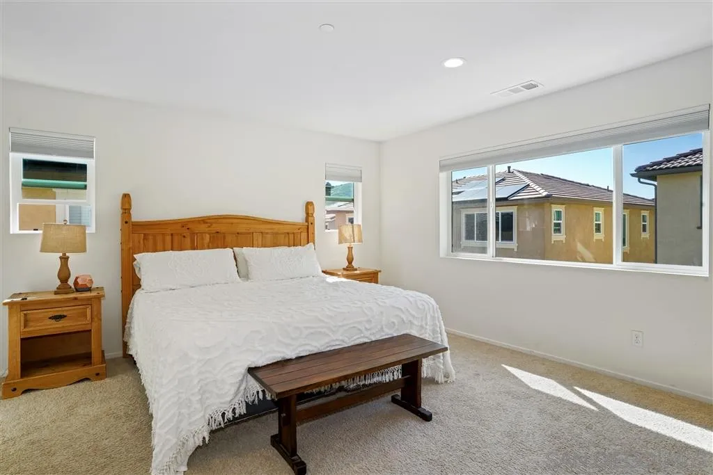 270 Oberlander Way Fallbrook, CA 92028 - Photo 10 of 23 a bedroom with a bed and a table
