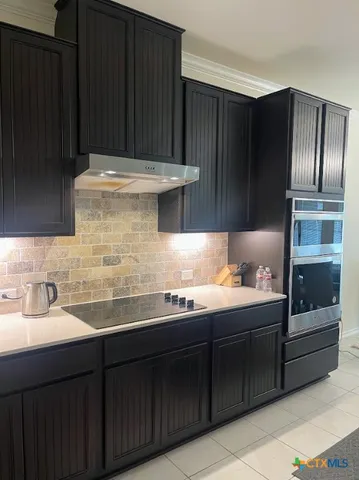 a kitchen with a sink and cabinets