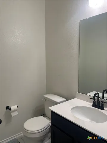 a bathroom with a sink a toilet