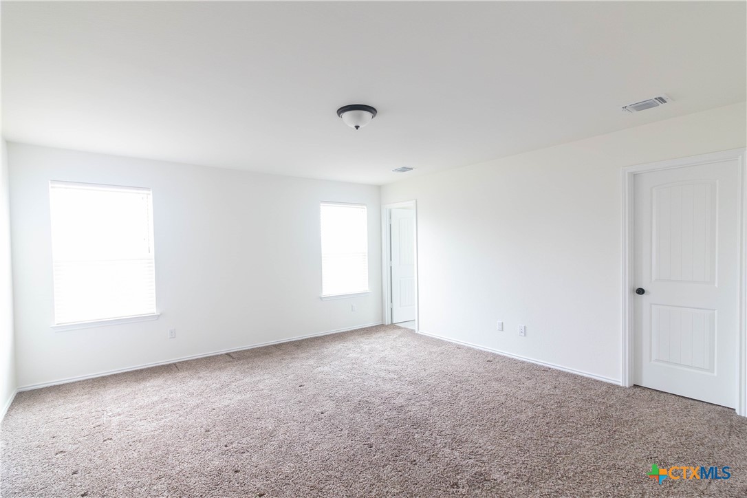 1131 Aronia Lane Georgetown, TX 78626 - Photo 16 of 36 a view of an empty room with a window