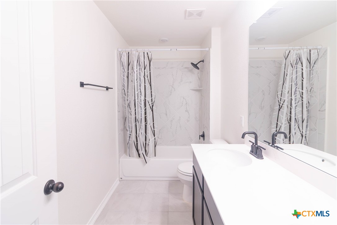 1131 Aronia Lane Georgetown, TX 78626 - Photo 20 of 36 a bathroom with a sink and a mirror