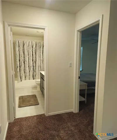 a view of entryway with bathroom