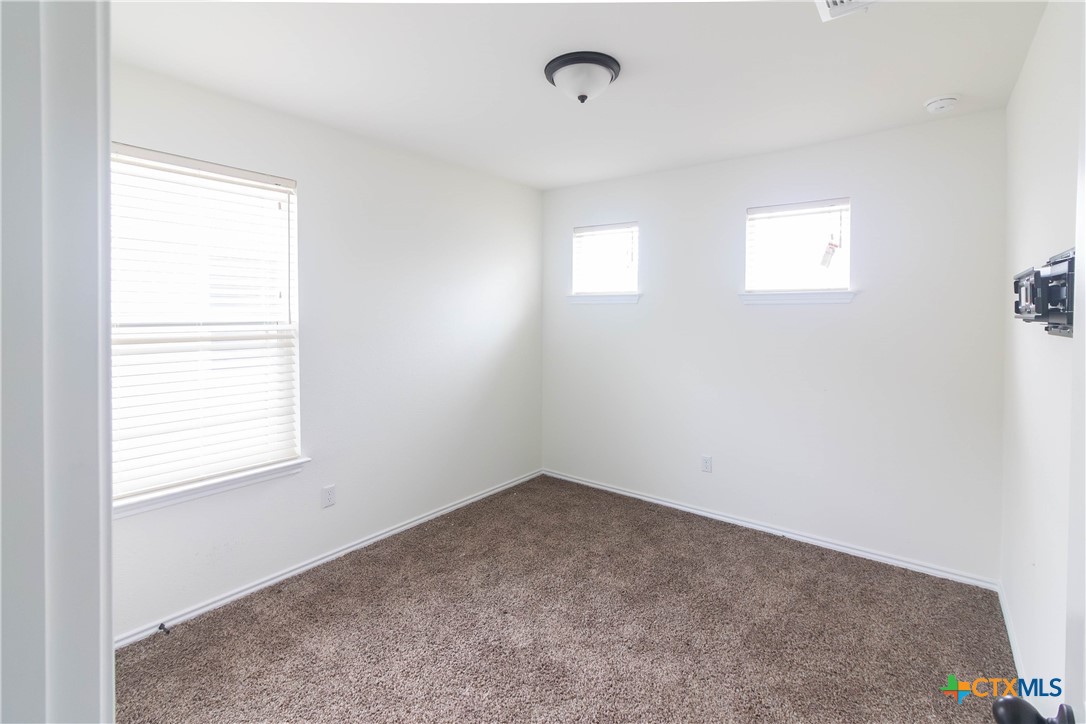 1131 Aronia Lane Georgetown, TX 78626 - Photo 25 of 36 an empty room with a window