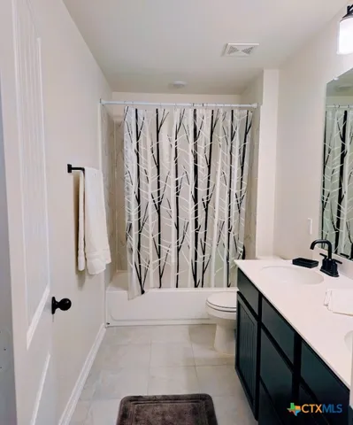 a bathroom with a sink a toilet and a bathtub