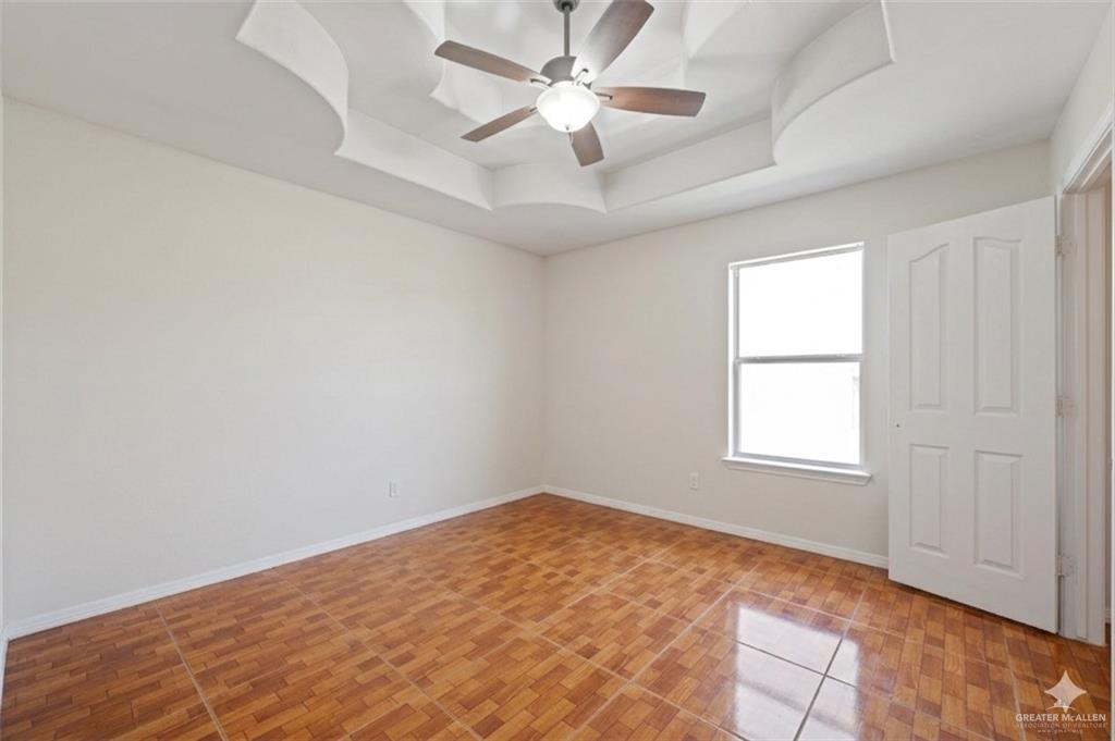 24175 Engleman Road Edcouch, TX 78538 - Photo 16 of 22 an empty room with windows and fan