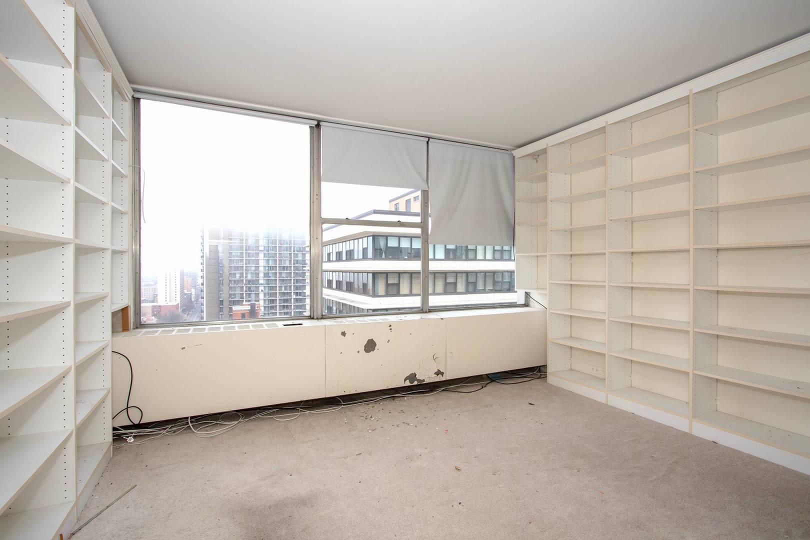 5757 North Sheridan Road, Unit 18J Chicago, IL 60660 - Photo 14 of 16 a room with a bed and a window