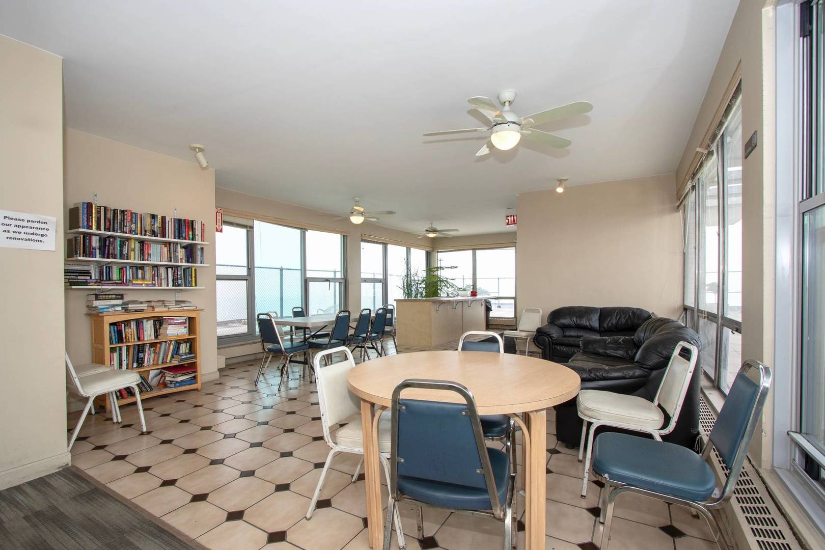 5757 North Sheridan Road, Unit 18J Chicago, IL 60660 - Photo 16 of 16 a view of a dining room with furniture and a large window