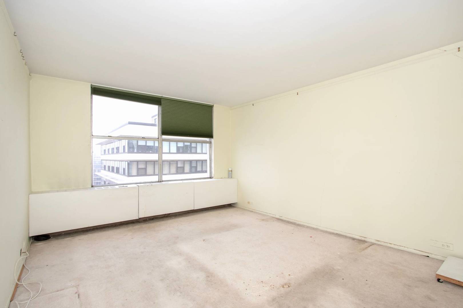 5757 North Sheridan Road, Unit 18J Chicago, IL 60660 - Photo 7 of 16 a view of an empty room with a window