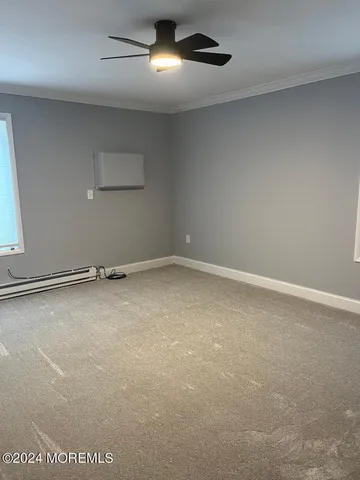 an empty room with a empty space and windows