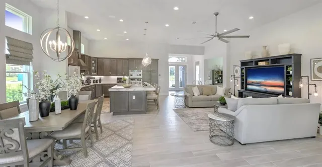 a bedroom with a large bed and a large window
