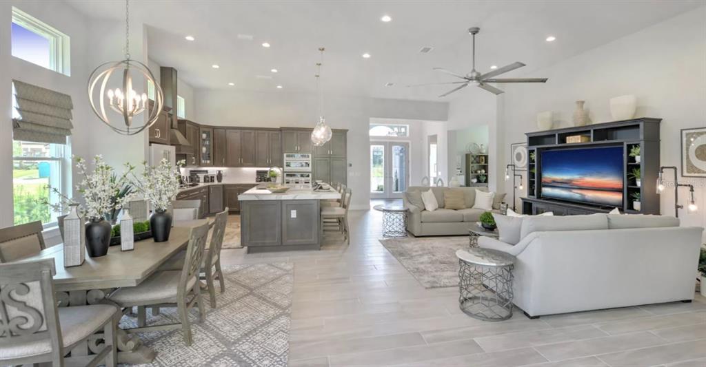 177 Aspen Way Palm Coast, FL 32137 - Photo 5 of 11 a living room with furniture and a flat screen tv