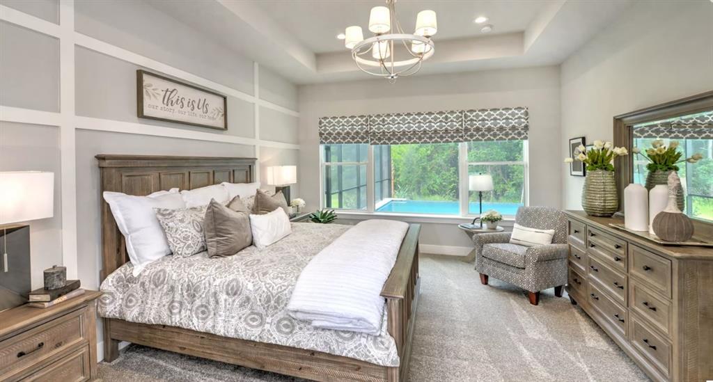 177 Aspen Way Palm Coast, FL 32137 - Photo 6 of 11 a bedroom with a large bed and a large window