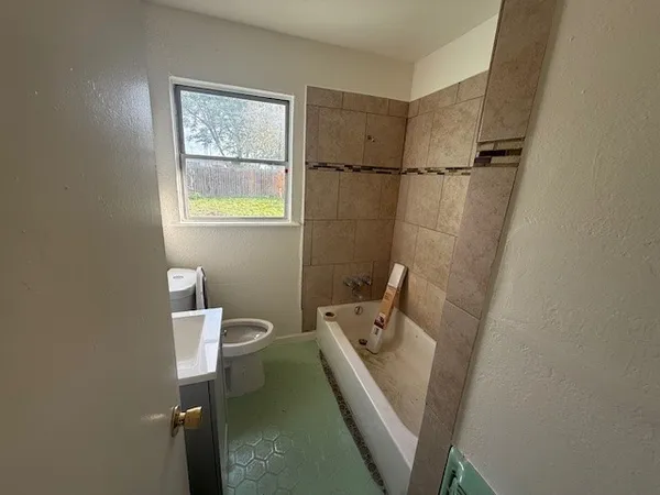 a bathroom with a sink and toilet