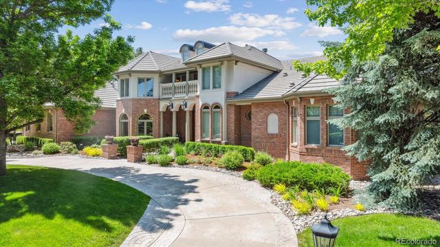 a front view of a house with a yard and porch