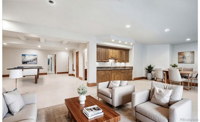 a living room with furniture and a rug