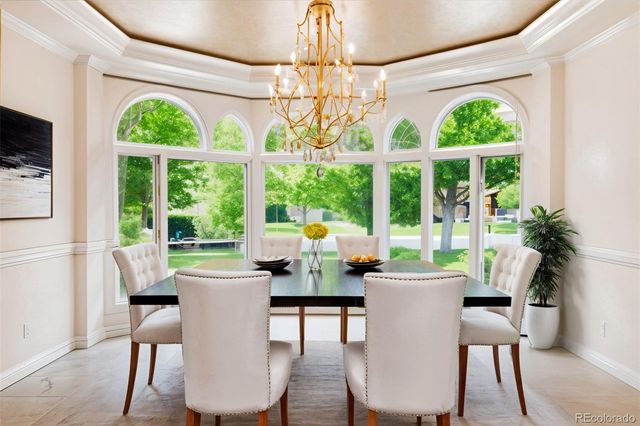 a bedroom with a large bed and a large window