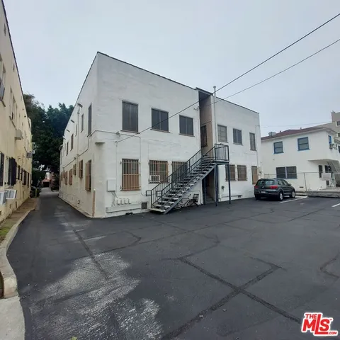 a view of a house with a parking space