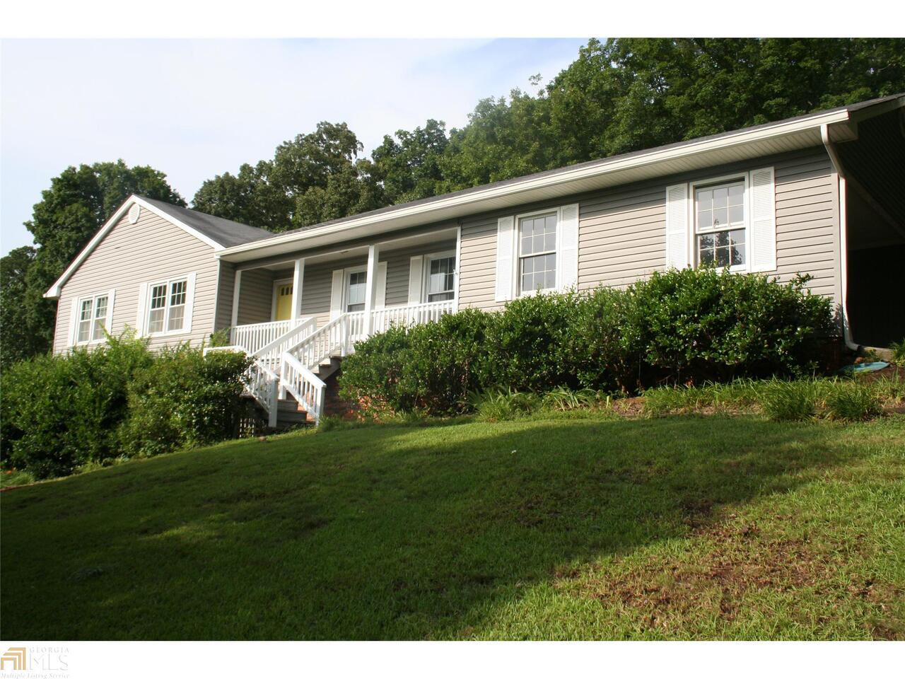 413 Flora Avenue Southeast Rome, GA 30161 - Photo 1 of 1 a front view of a house with a yard