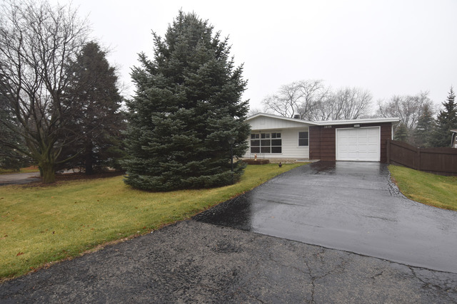 59 3n686 Rt West Chicago, IL 60185 - Photo 1 of 2 a view of a house with backyard and trees